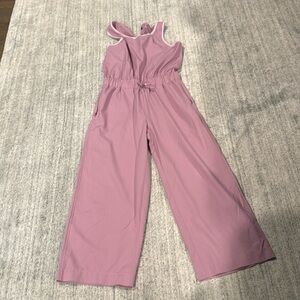 Athletic girl jump for joy jumpsuit size 8-10
